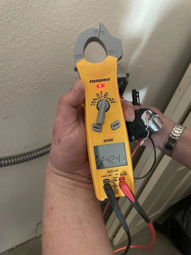 Voltage testing with clamp meter during Recessed Lighting Installation in Killingly
